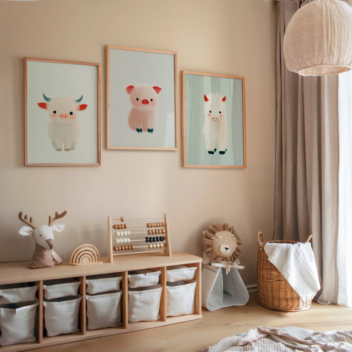 Three framed nursery prints featuring cute soft-colored farm animals above a wooden storage unit with fabric bins in a cozy, neutral-toned children's room.