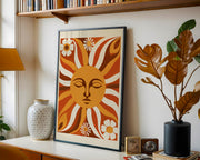 Retro wall art print featuring a vibrant sun face and cheerful daisies in warm colours  - Lifestyle Image