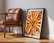 Retro wall art print featuring a vibrant sun face and cheerful daisies in warm colours  - Lifestyle Image