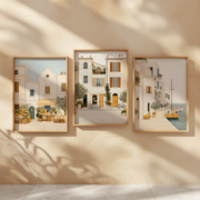 Mediterranean Days Set of 3 Prints displayed in a bright room, featuring elegant coastal village wall art
