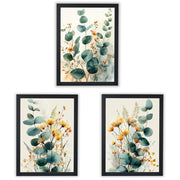 Three framed botanical art prints with black frames, featuring watercolor-style eucalyptus leaves and small yellow-orange flowers on a light cream background, arranged on a white background.
